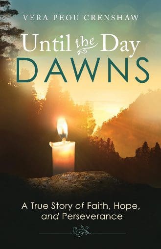 Book cover with candle and sunrise.